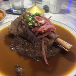 AGUASANTA signature dishes Brisket BaoSteak and FritesBirria-Style Lamb